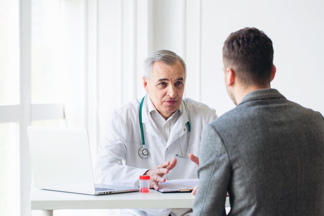 A doctor speaking with a patient