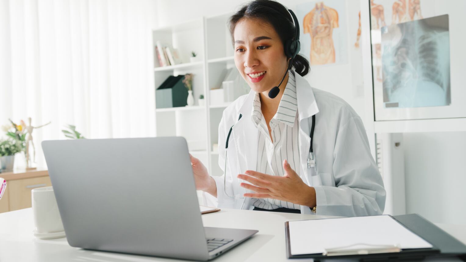 A doctor speaking with a patient through a video call. 