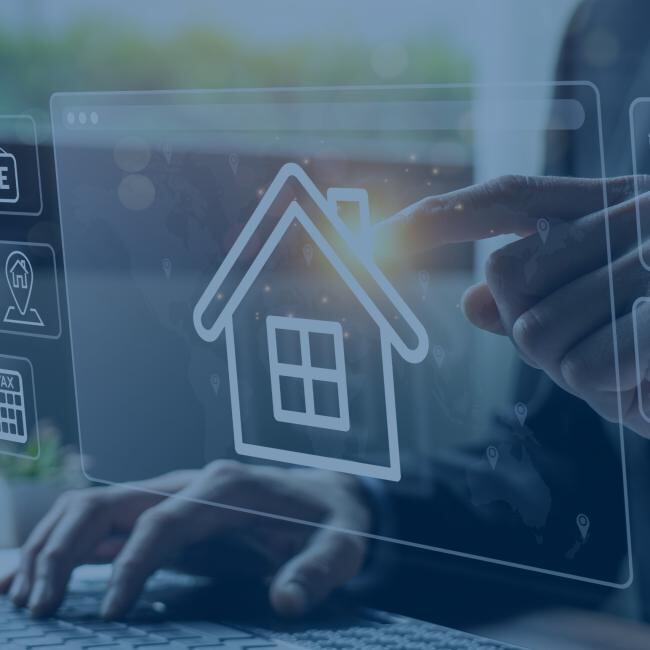 a real estate agent working on a laptop. photo has an overlay of house and analytics icons