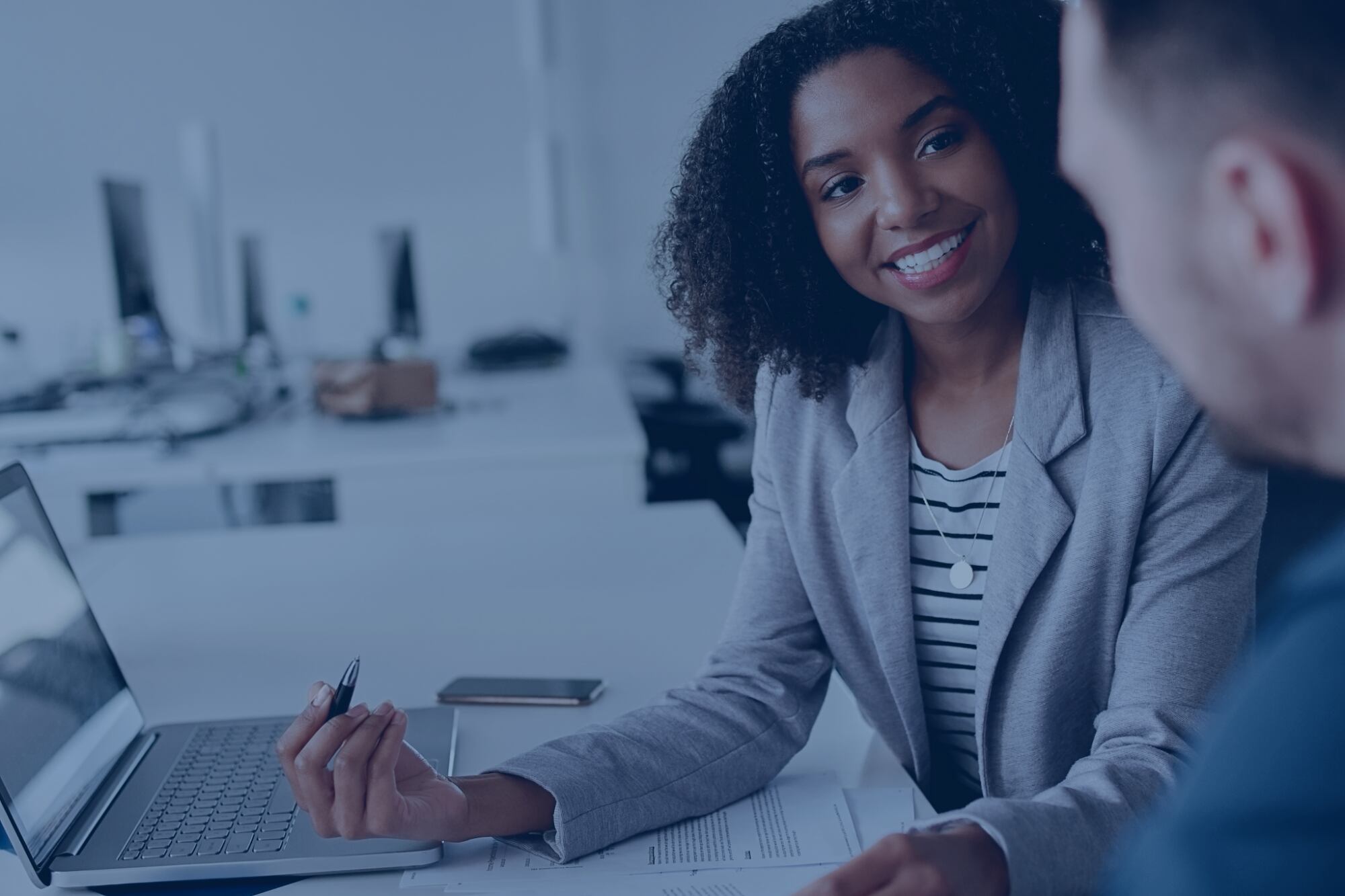 Financial adviser sitting with a customer. 