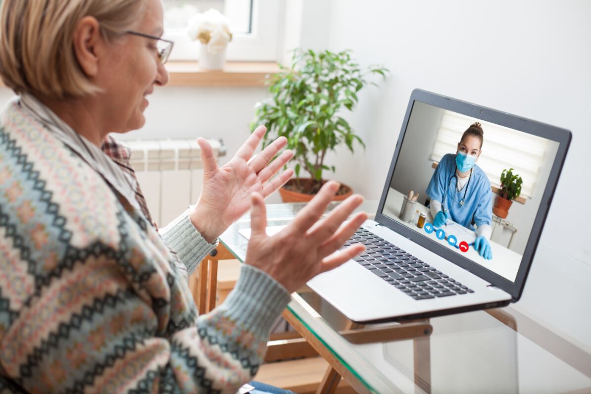 A remote third-party interpreter assisting hospital staff and patients with interpretation services.