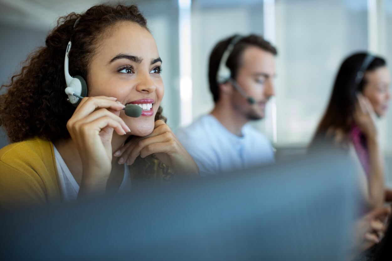 A credit union employee offering over-the-phone (OPI) interpretation services. 